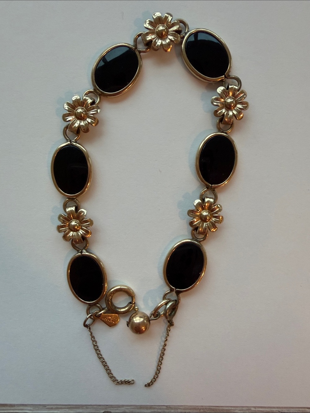 Gold Flower Link Bracelet with Black Oval Stones
